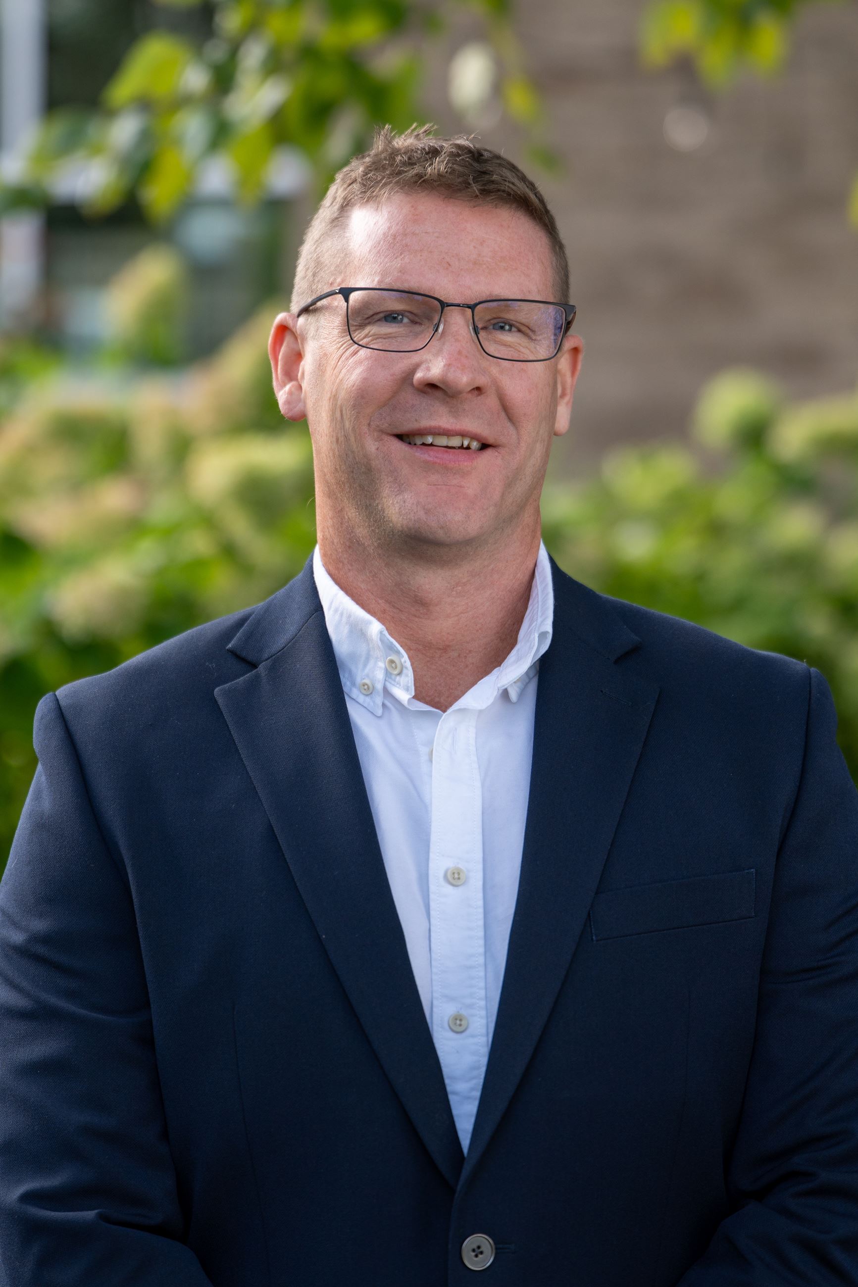 man with black suit jacket and white shirt 
